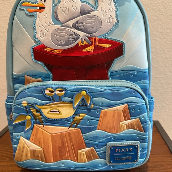 NWT Loungefly Nemo Blue and Red Pixar Seagulls and Crab Mini Backpack